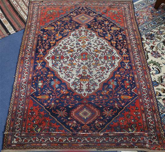 A Shiraz cream ground medallion rug, 196cm x 134cm